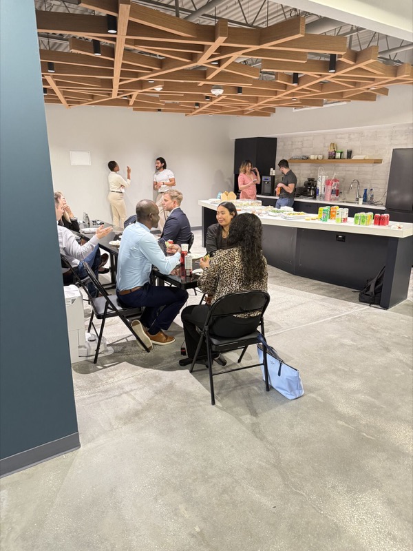 CoLab Haus common area — team gathering in the facility kitchen